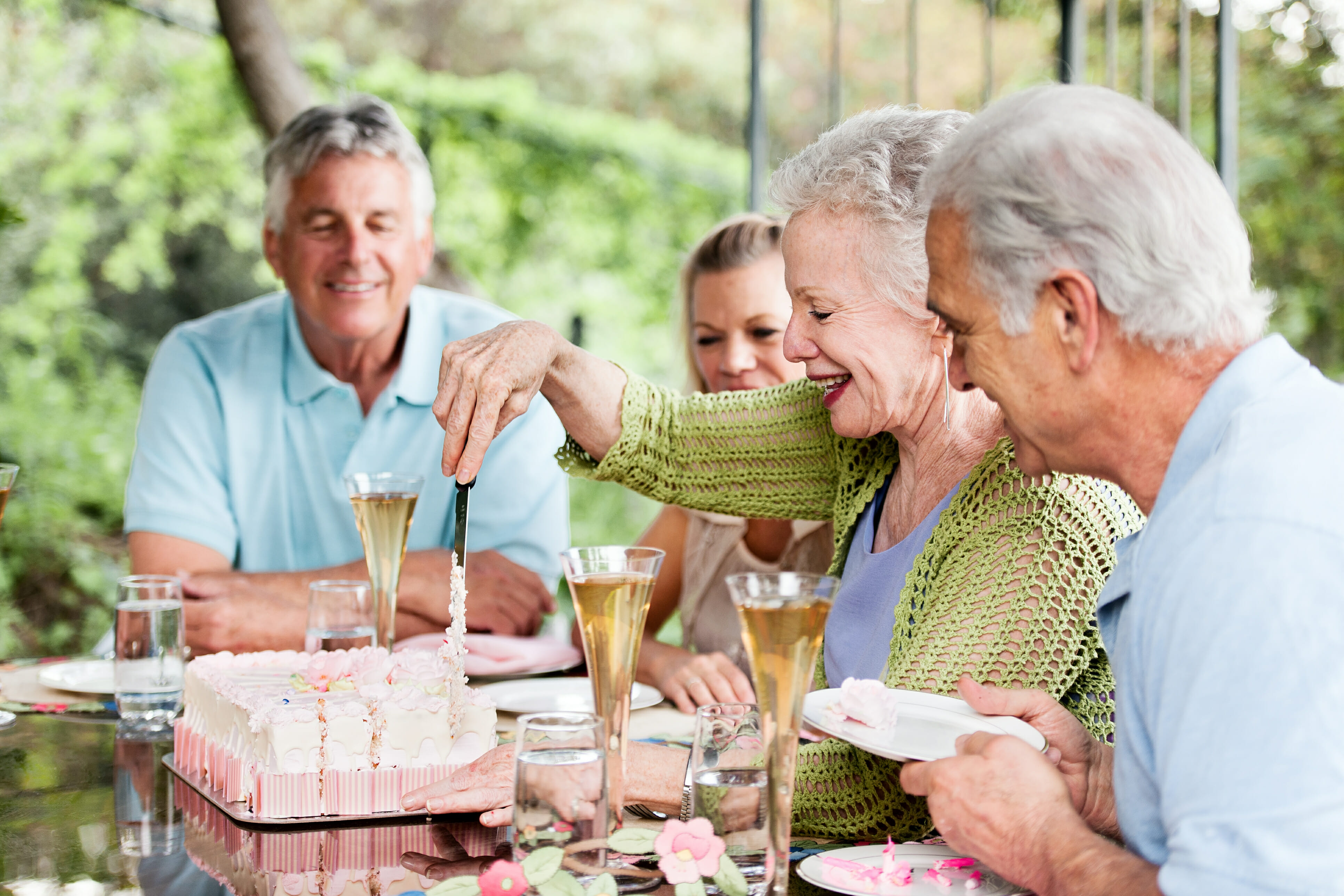 Senior friends celebrating life and Younging™ at Tradition Assisted Living